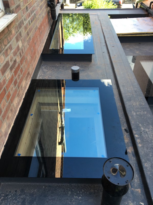 Multiple flat roof skylights on extension in Swiss Cottage